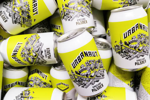 Many cans of Urbanaut Pilsner beer